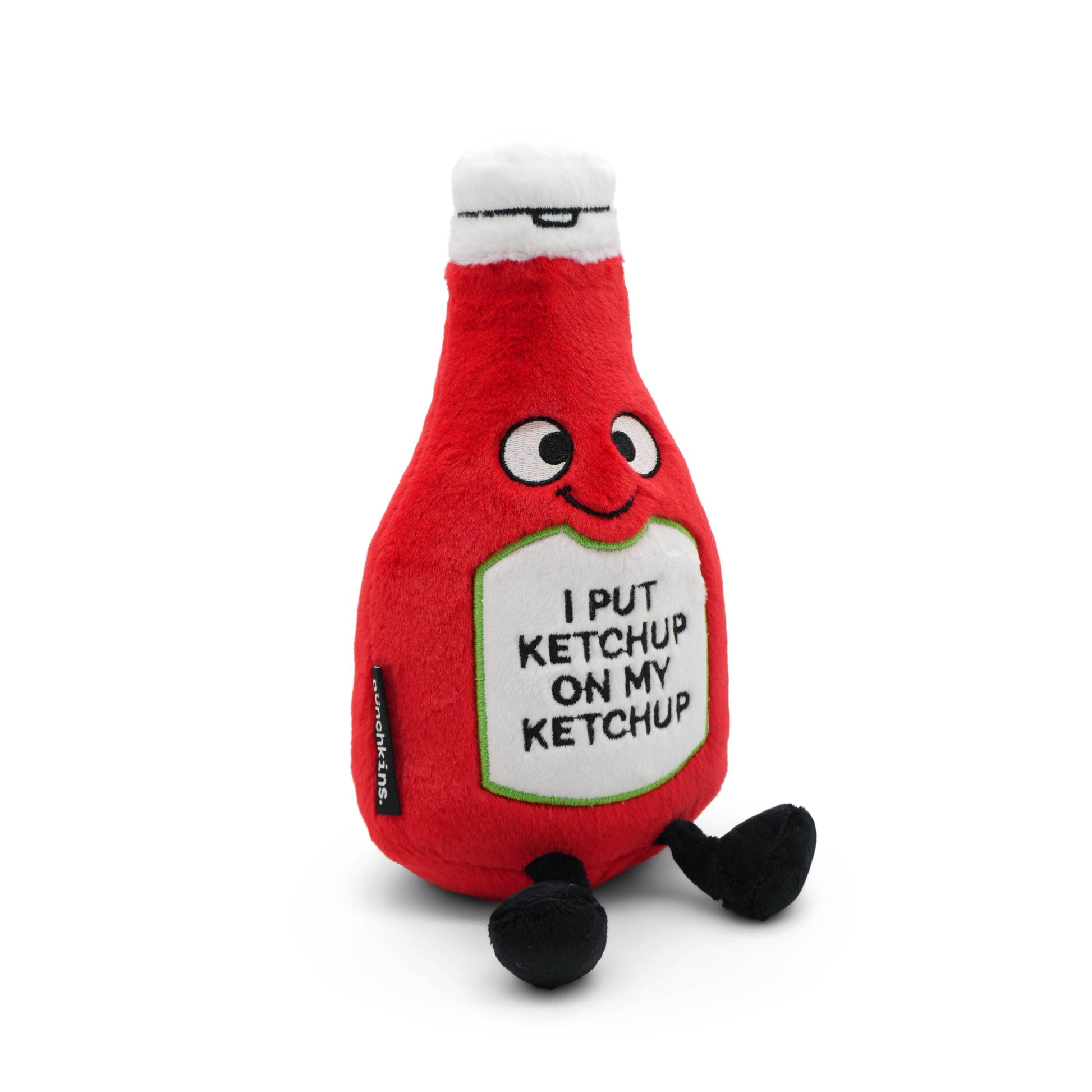 Plush toy resembling a ketchup bottle with text on a white background