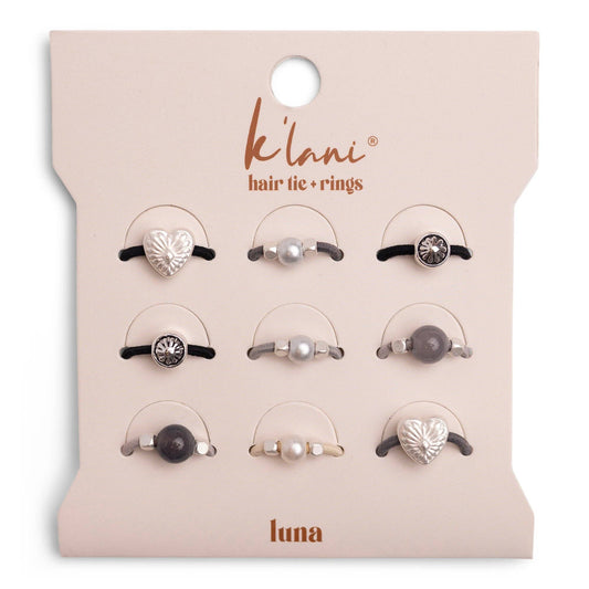 Set of hair tie and rings on a 'klani' branded card with 'luna' branding.