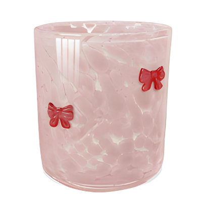 Pink marbled vase with red bow decorations on a white background