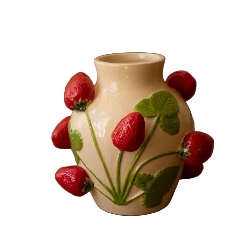 Ceramic vase with  raised strawberry designs on a white background