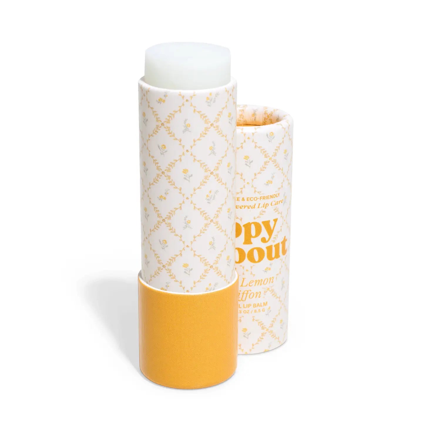Lip balm in a decorative paper tube with yellow and white design on a white background