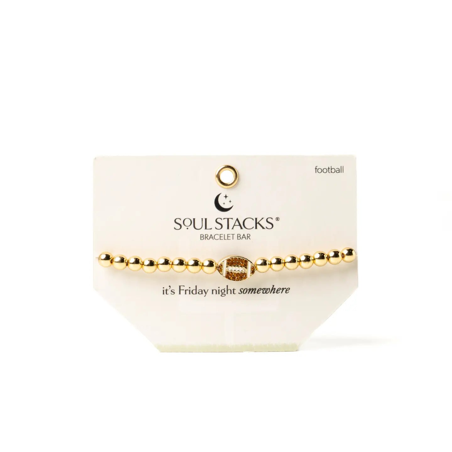 A gold beaded bracelet bar with a football charm, displayed on a white card from Soul Stacks. The card features the brand logo and the text 'SOUL STACKS BRACELET BAR' and 'it's Friday night somewhere'.