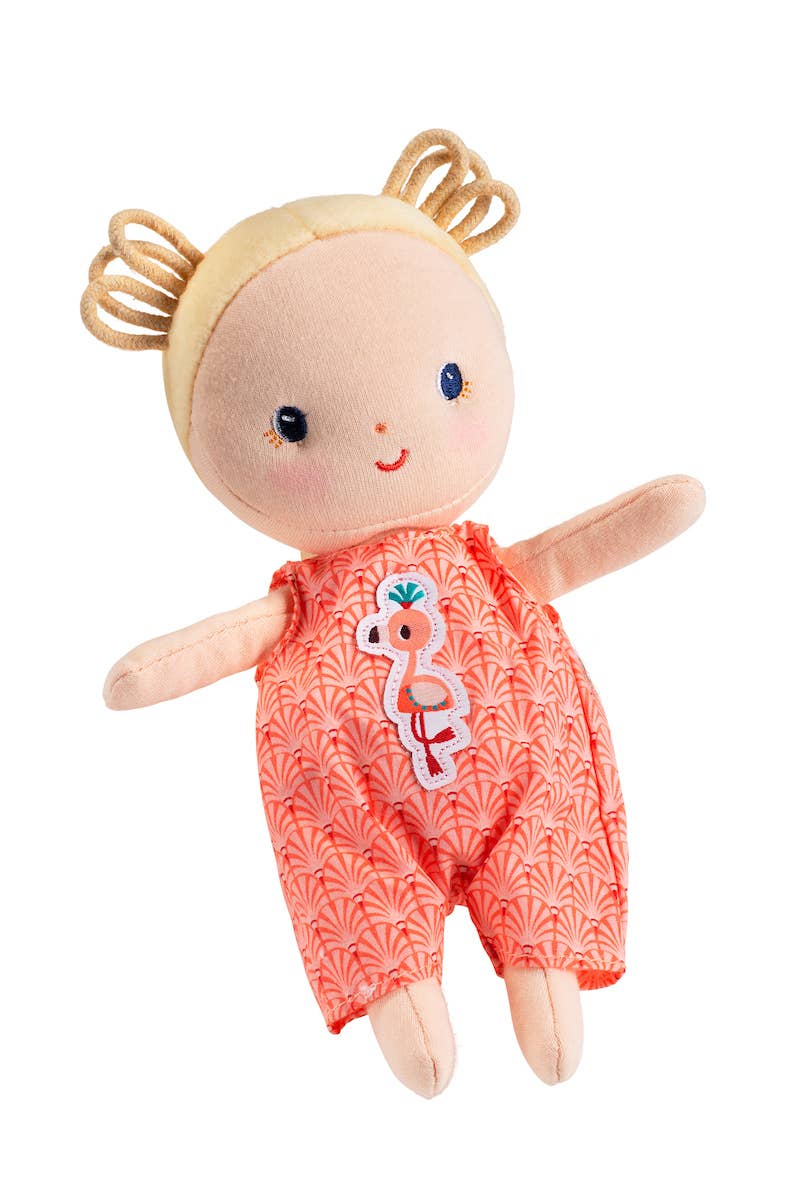 Toy doll with a floral patterned outfit on a white background