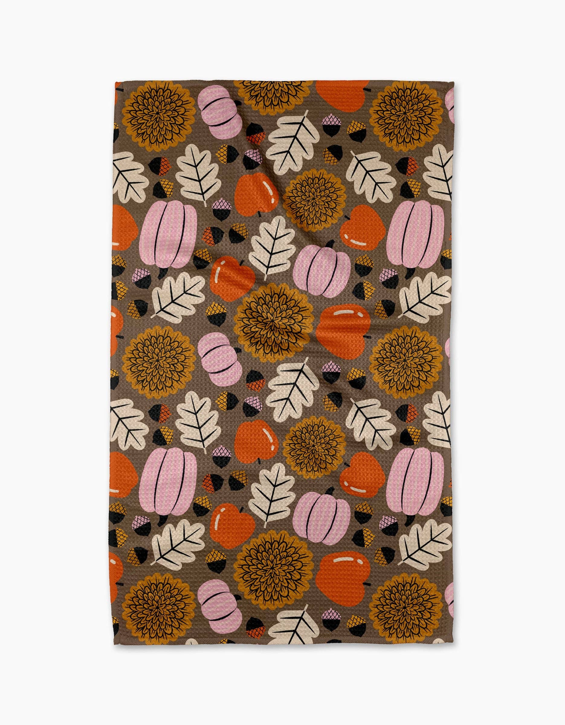 Patterned product with pumpkins, leaves, and flowers on a brown background