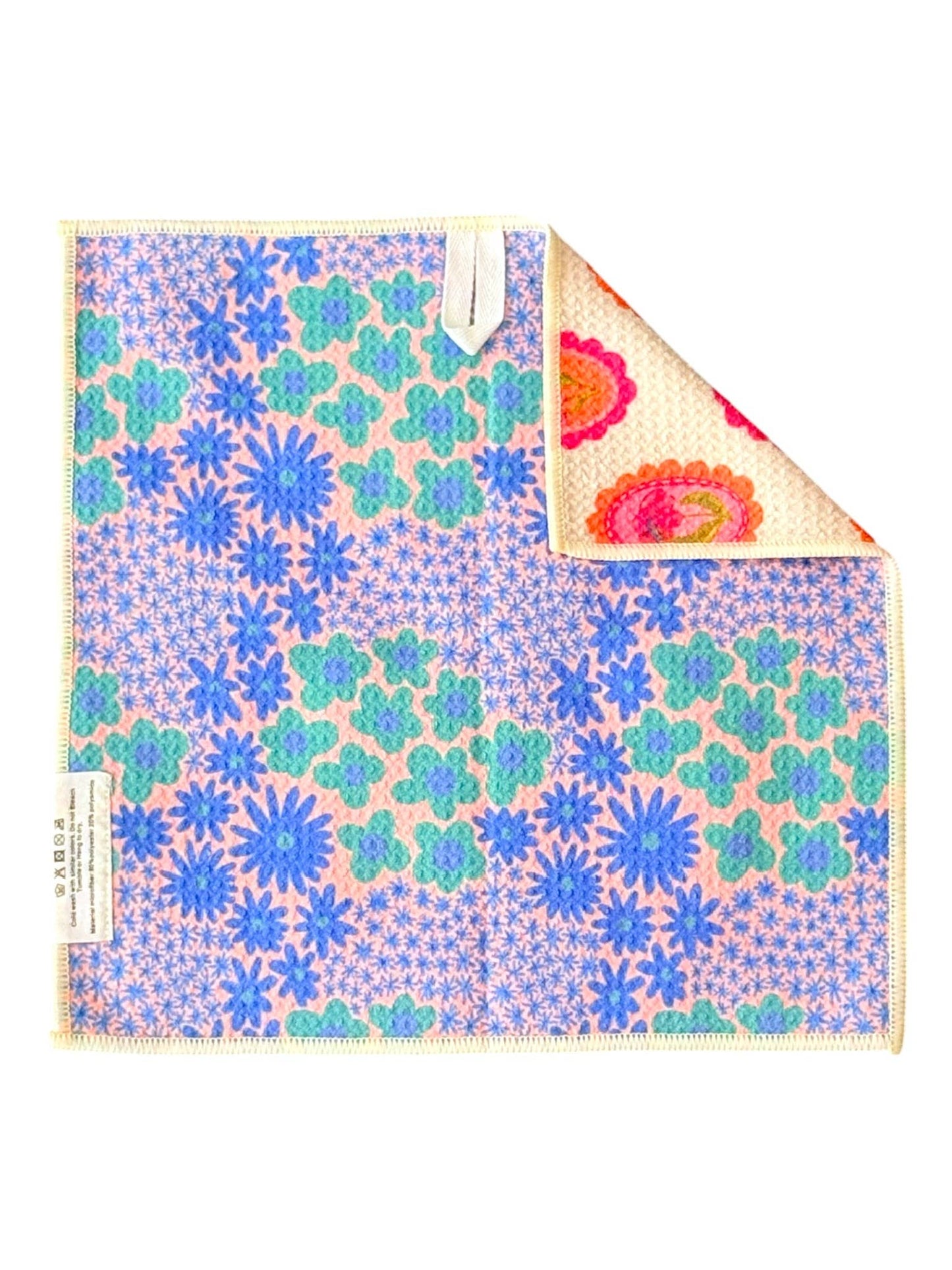 Floral patterned towel with colorful design on a white background