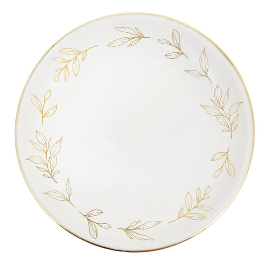 White plate with gold leaf patterns on a white background
