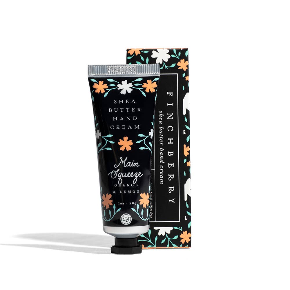 Shea butter hand cream with floral packaging on a white background