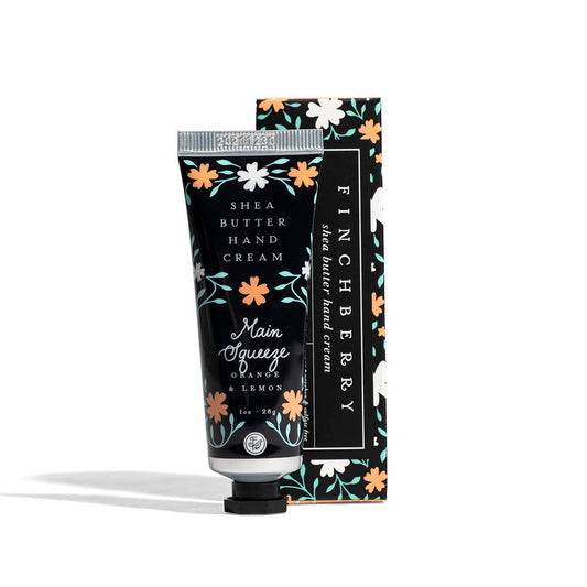 Shea butter hand cream with floral packaging on a white background