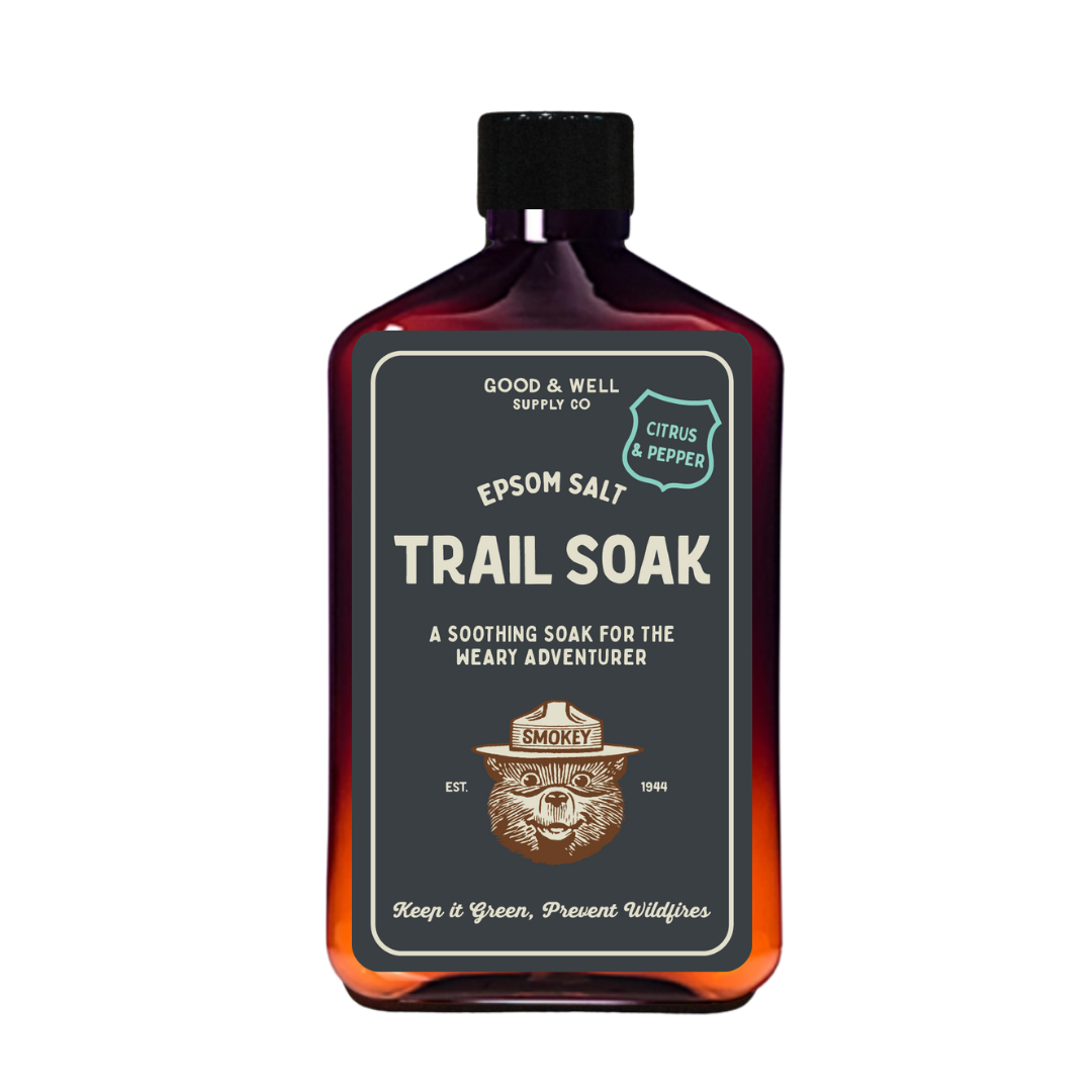 Bottle of Epsom Salt Trail Soak with Smokey Bear design on a white background