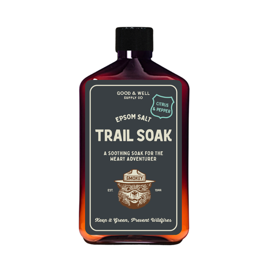 Bottle of Epsom Salt Trail Soak with Smokey Bear design on a white background