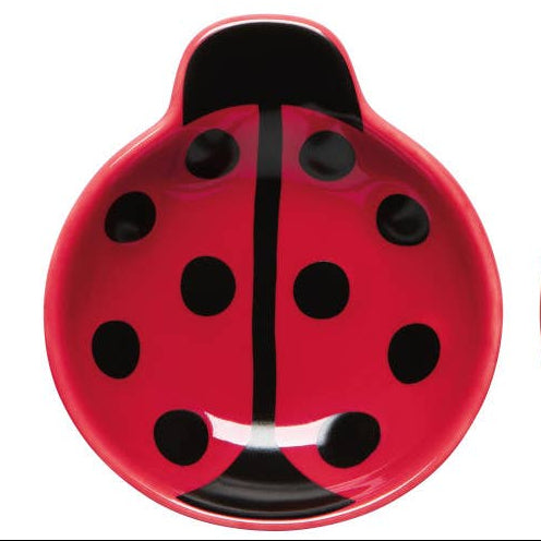 Red lady bug shaped bowl on a white background