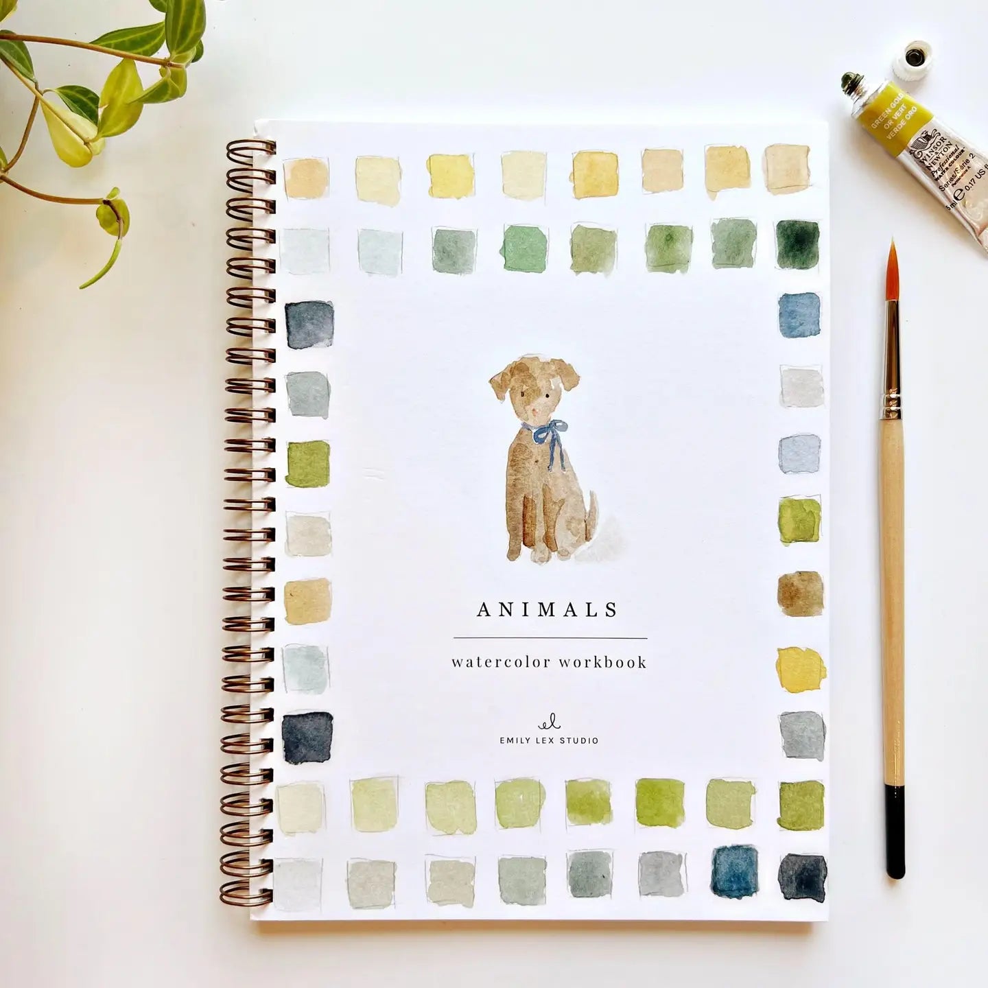 Watercolor workbook titled 'Animals' with a dog illustration on a white surface.