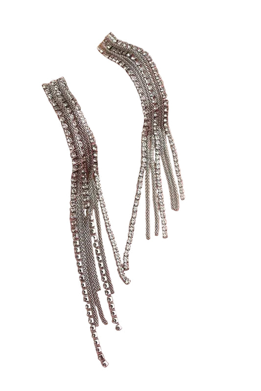 Two silver rhinestone and chain tassel style earrings on a white background