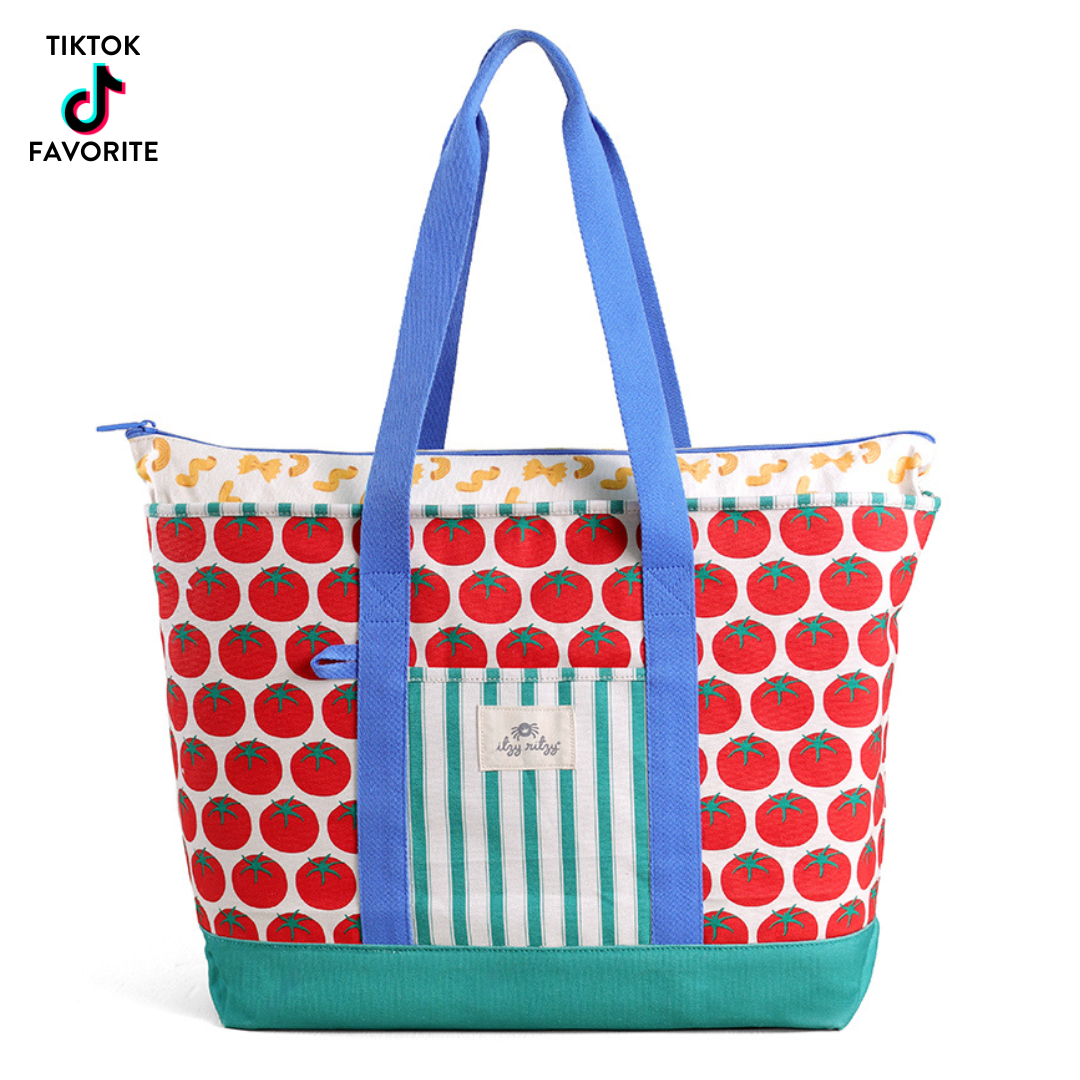 Tote bag with tomato pattern and blue handles on a white background