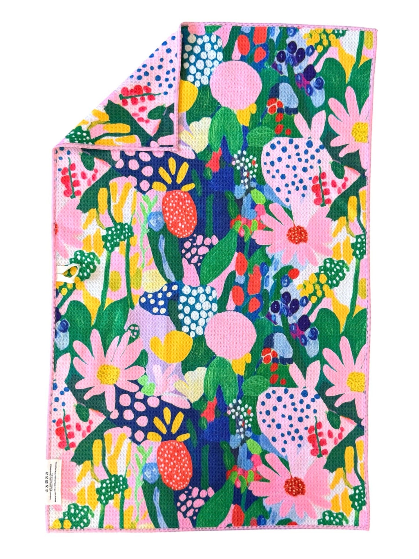 Colorful floral patterned towel on a white background