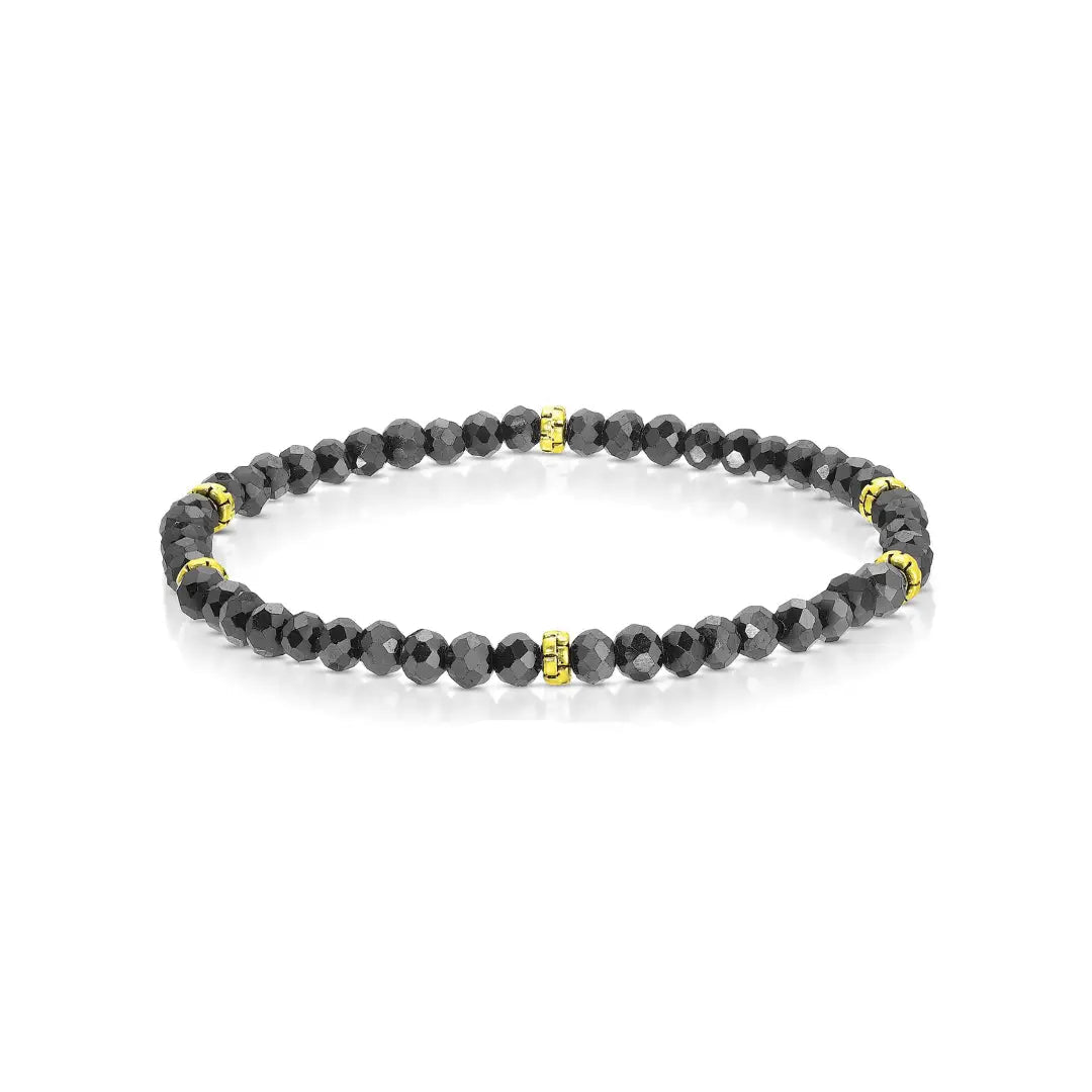 Black beaded bracelet with gold accents on a white background