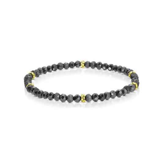 Black beaded bracelet with gold accents on a white background