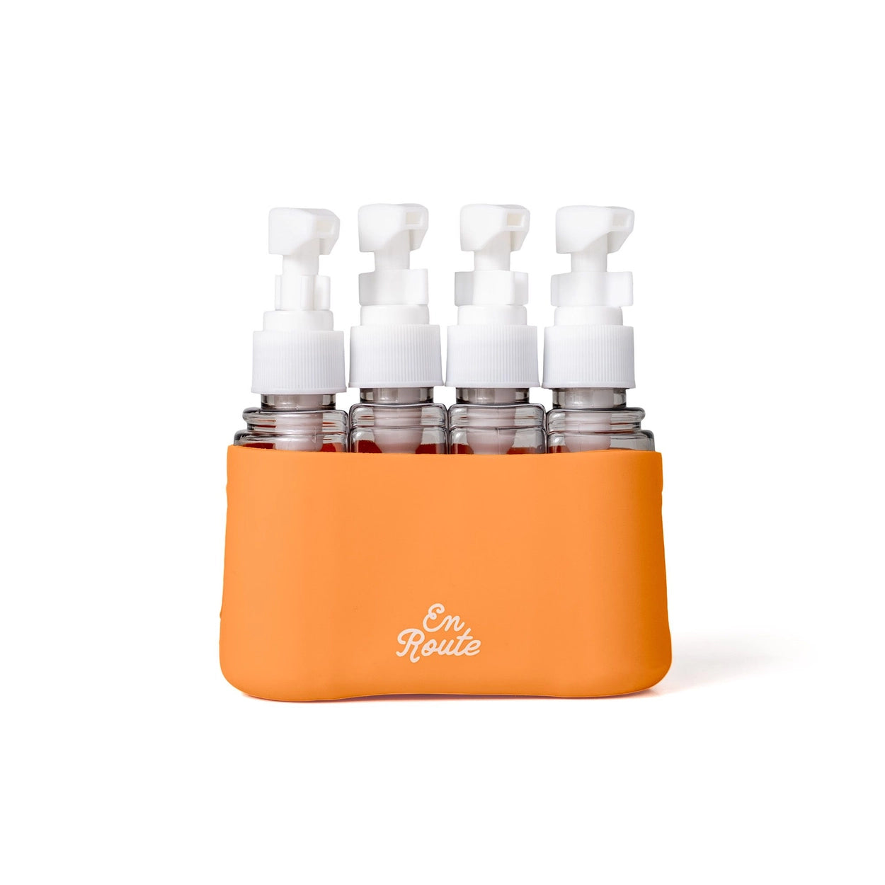 Orange holder with multiple small bottles and white pumps on a white background