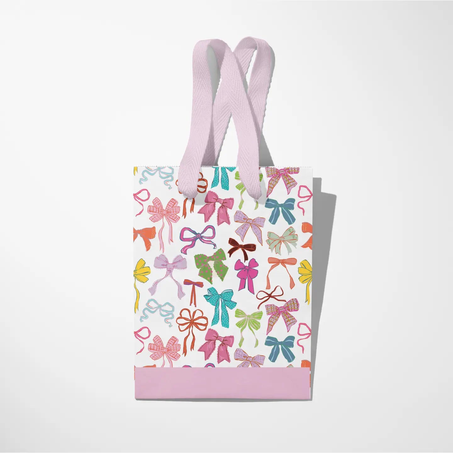 White gift bag with different colored bows, light purple ribbon handles, and a light purple stripe at the bottom on a white background