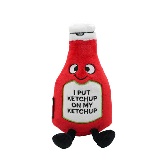 Plush toy shaped like a ketchup bottle with text on a white background