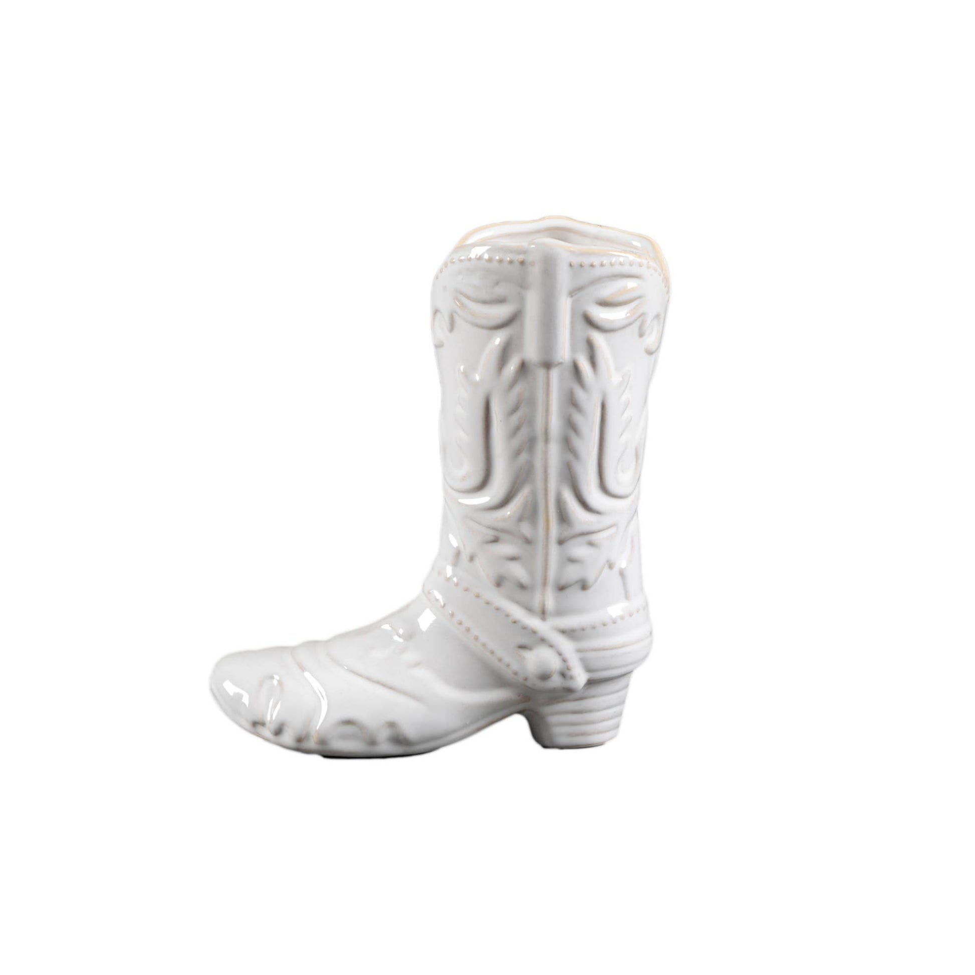 White ceramic cowboy boot shaped vase on a white background