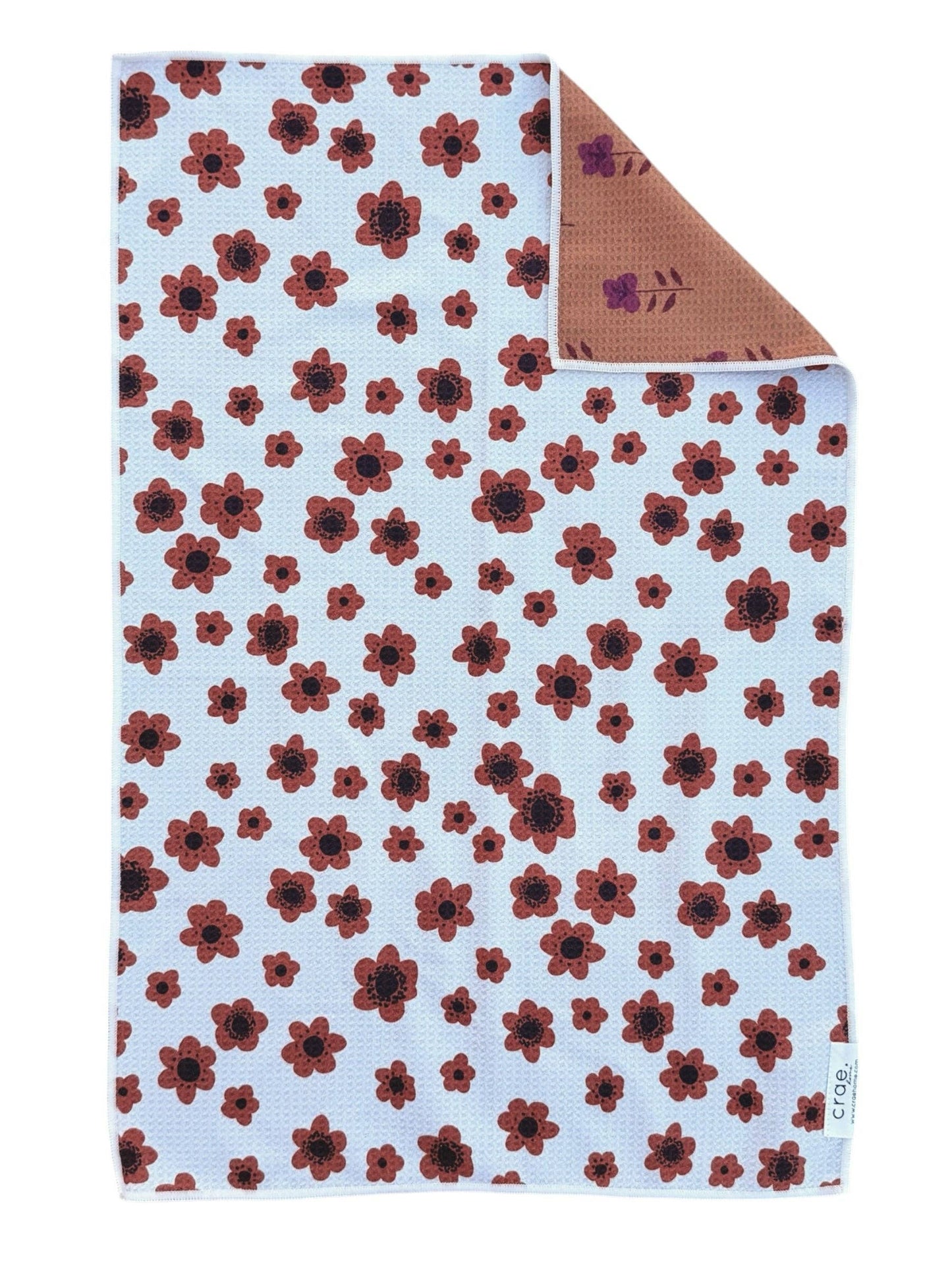 Floral patterned fabric with red flowers on a light blue background