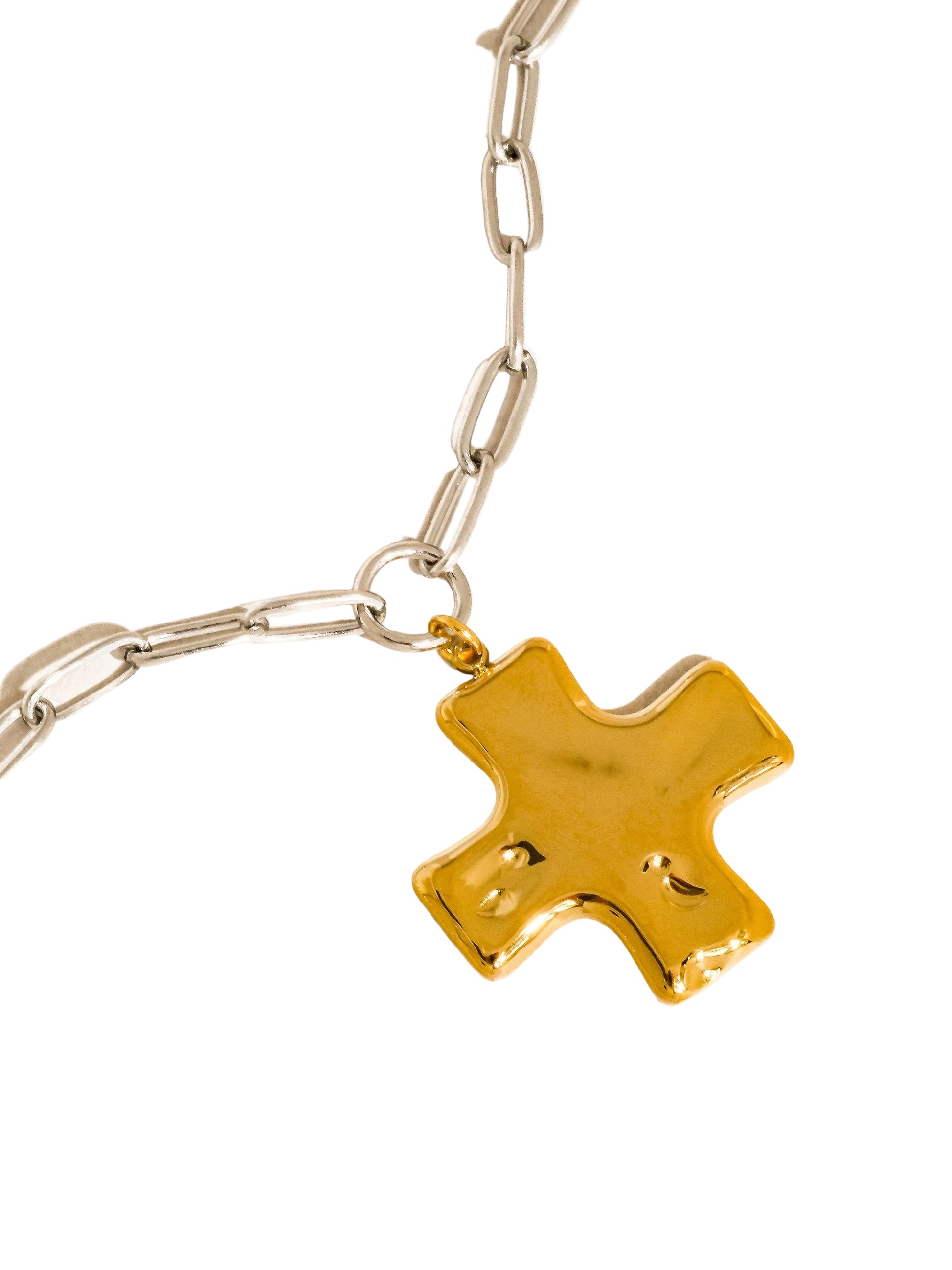 Gold star-shaped pendant on a chain against a white background