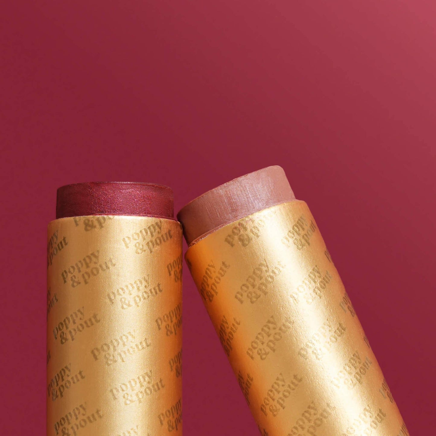 Two cylindrical products with 'Puppy & Pout' branding on a red background