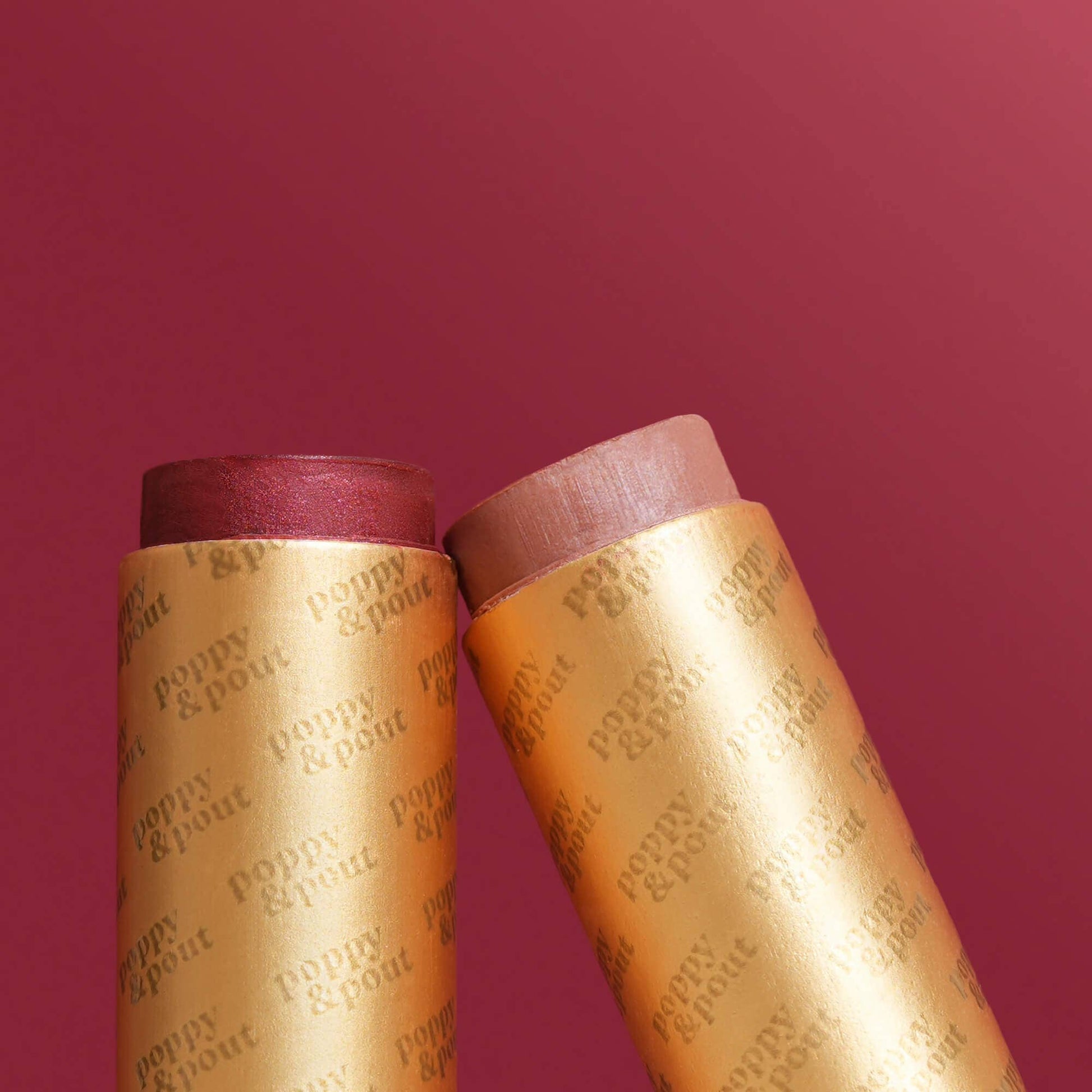 Two cylindrical products with 'Puppy & Pout' branding on a red background