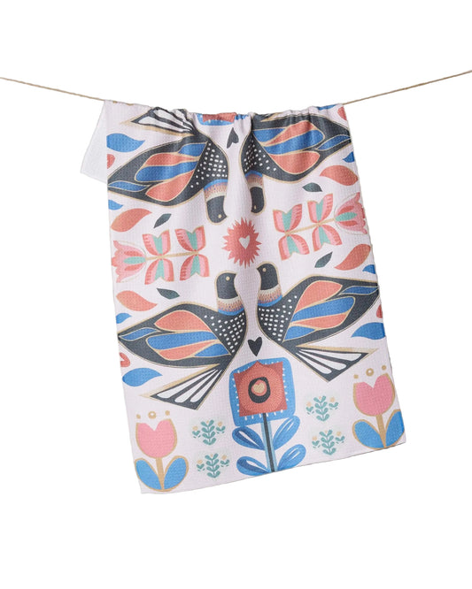 White tea towel with symmetrical pink, blue, gold, and dark grey birds and flowers design 