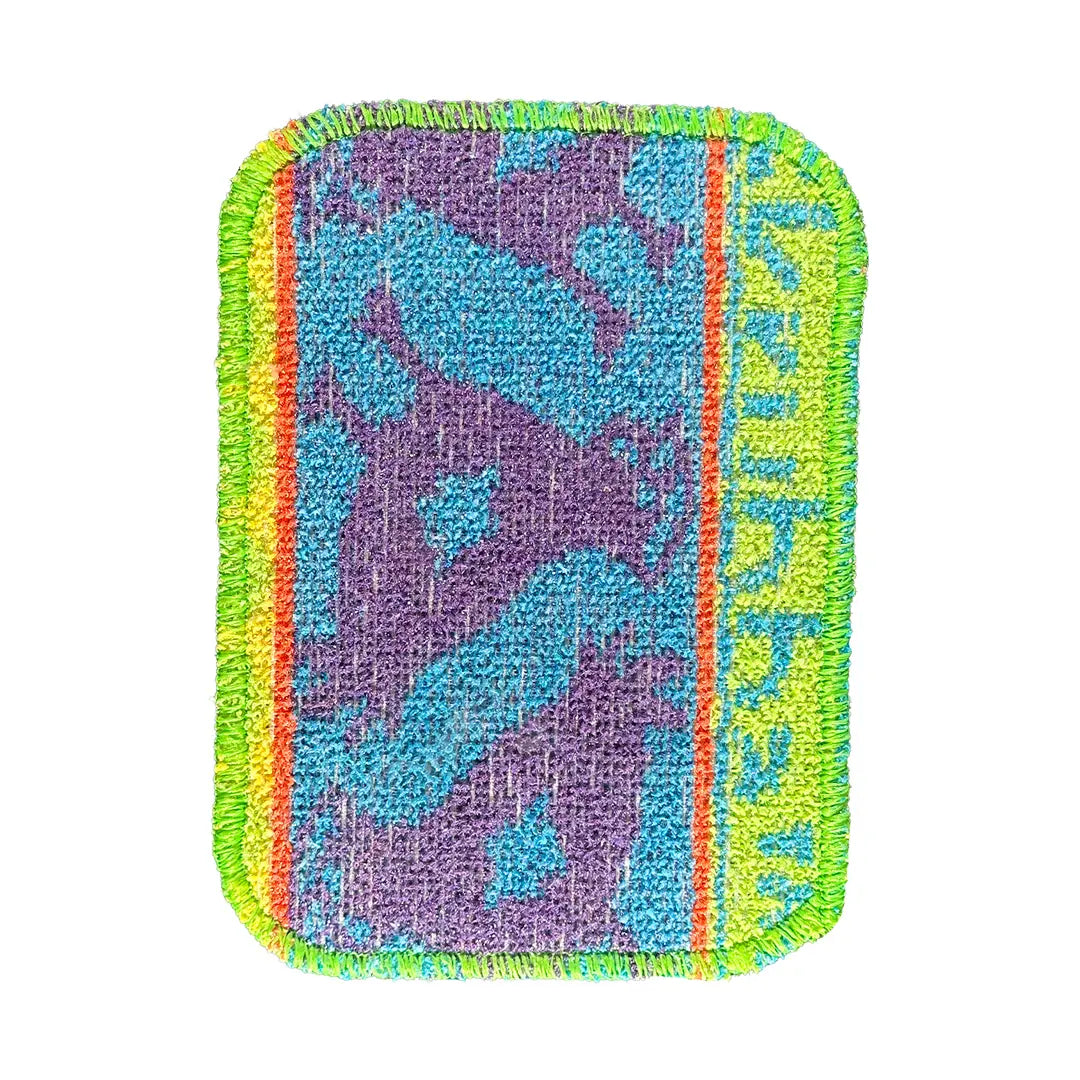 Textured patch with colorful border and abstract design on a white background