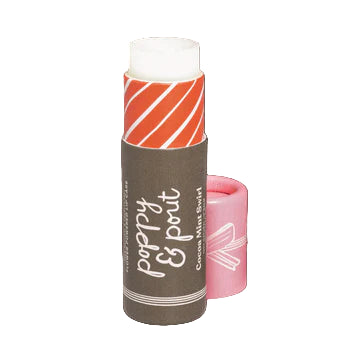 Lip balm with a brown and orange striped design on a brown background