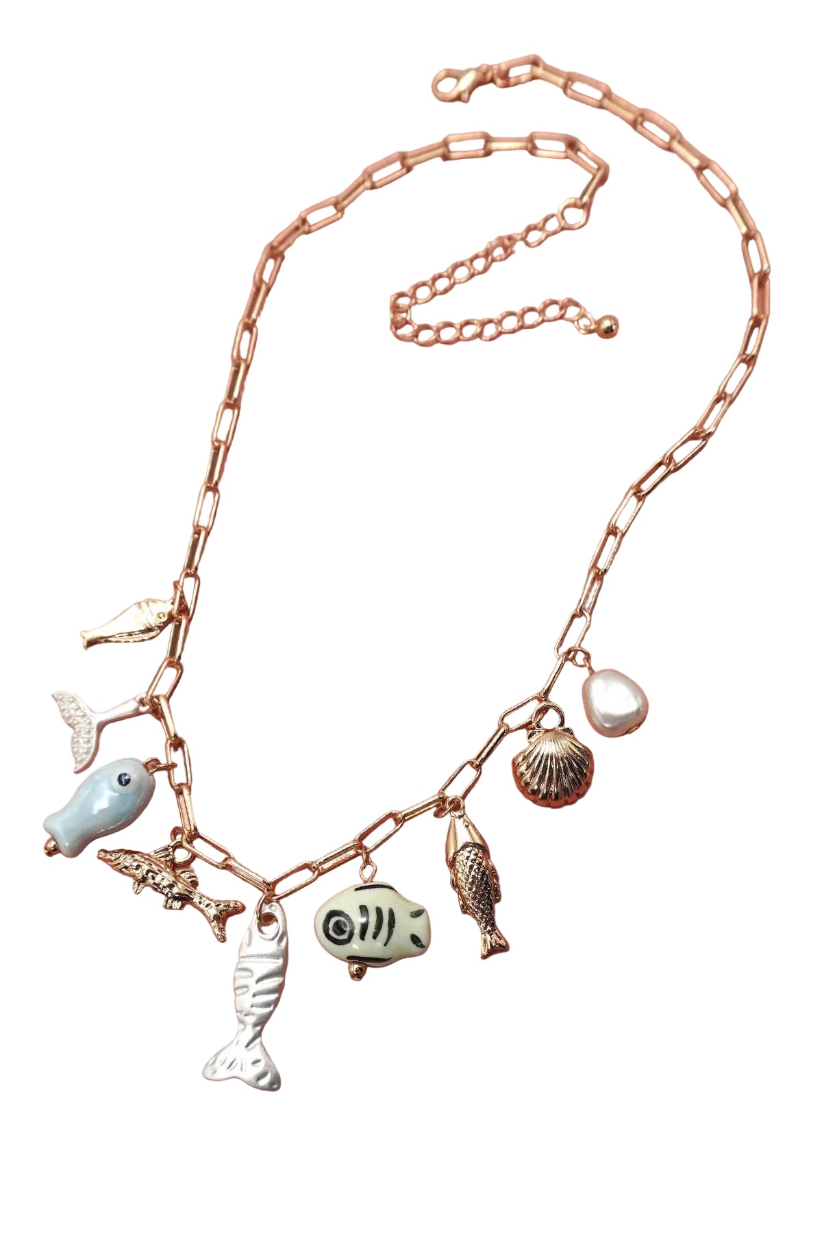 Necklace with various charms on a pink background