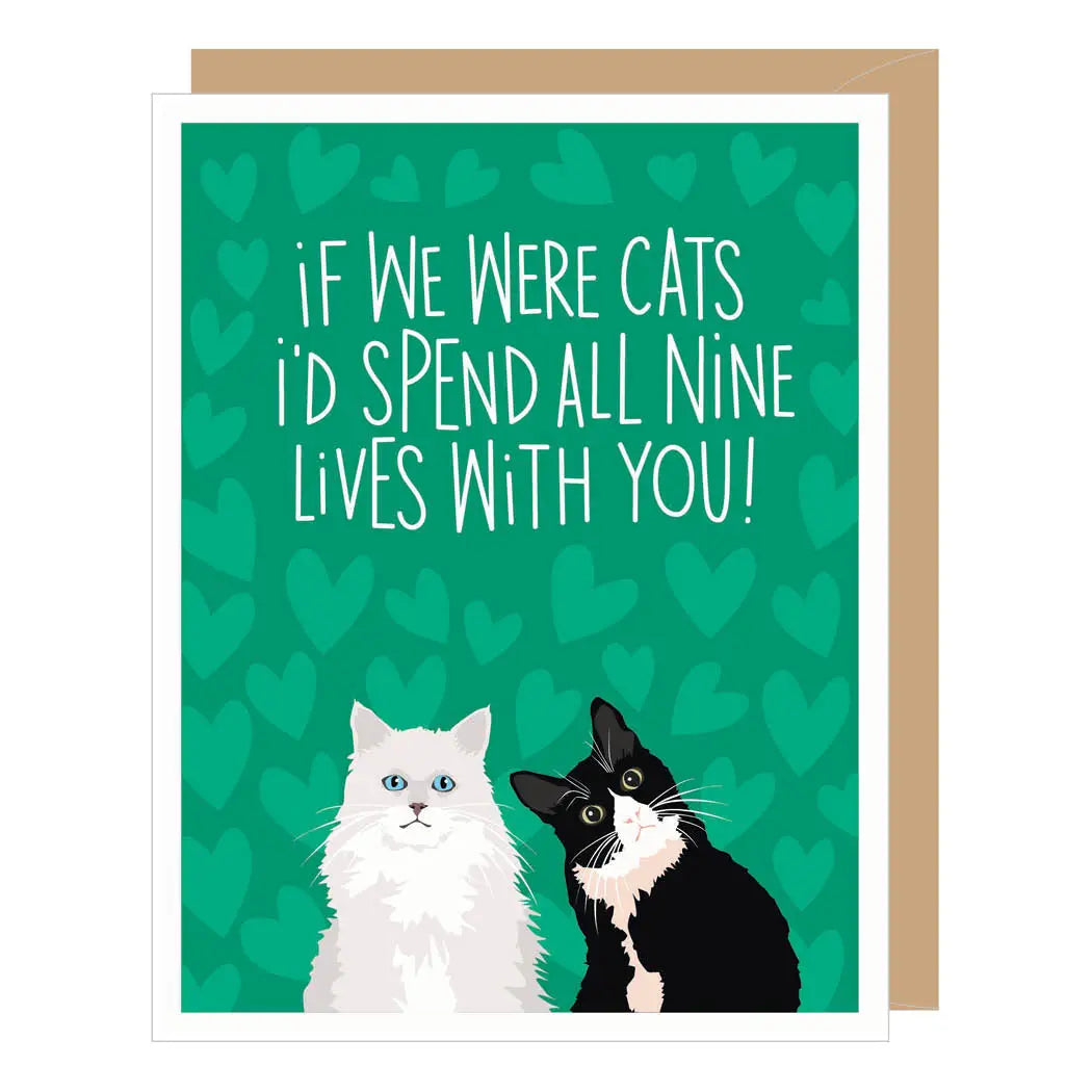 A green greeting card with a heart background, two cats sitting next to each other, and the text "if We Were Cats i'd Spend All Nine Lives With You!"