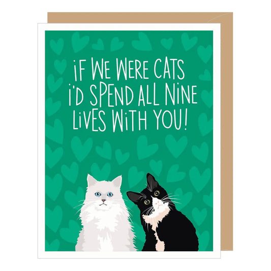 A green greeting card with a heart background, two cats sitting next to each other, and the text "if We Were Cats i'd Spend All Nine Lives With You!"