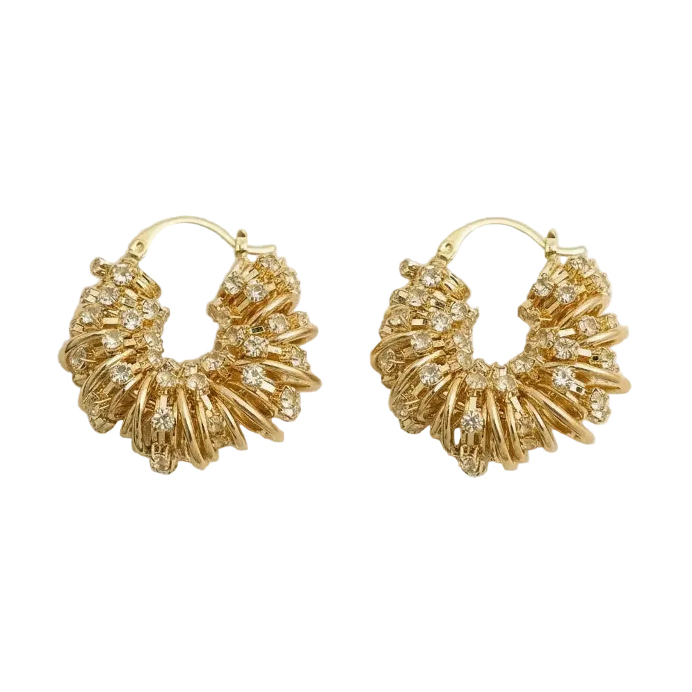 Pair of gold hoop earrings with diamond-like stones on a white background