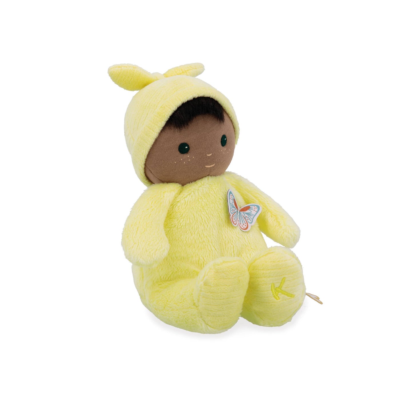 Plush toy baby in a yellow outfit with a butterfly emblem on a white background