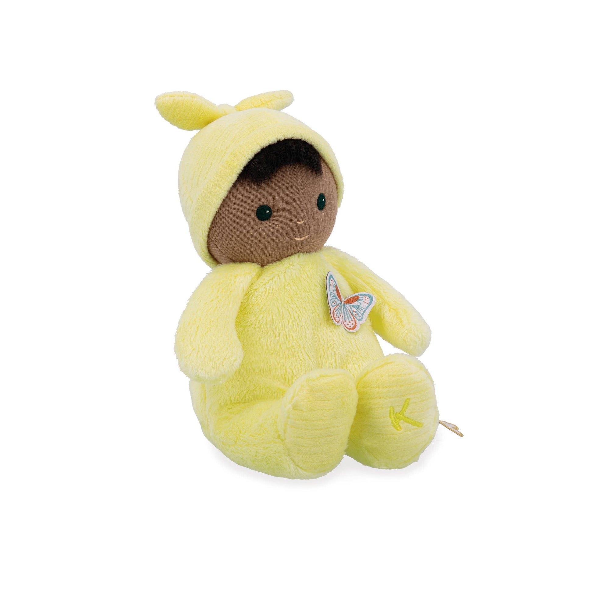Plush toy baby in a yellow outfit with a butterfly emblem on a white background