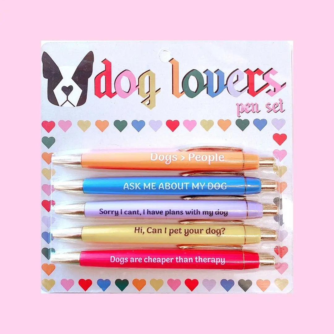 Set of pens with humorous dog-themed sayings in a package with rainbow colored hearts and a french bulldog design on a pink background