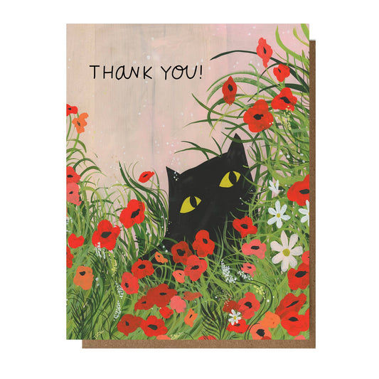 Greeting card with a black cat among red flowers and the text 'Thank You!'.