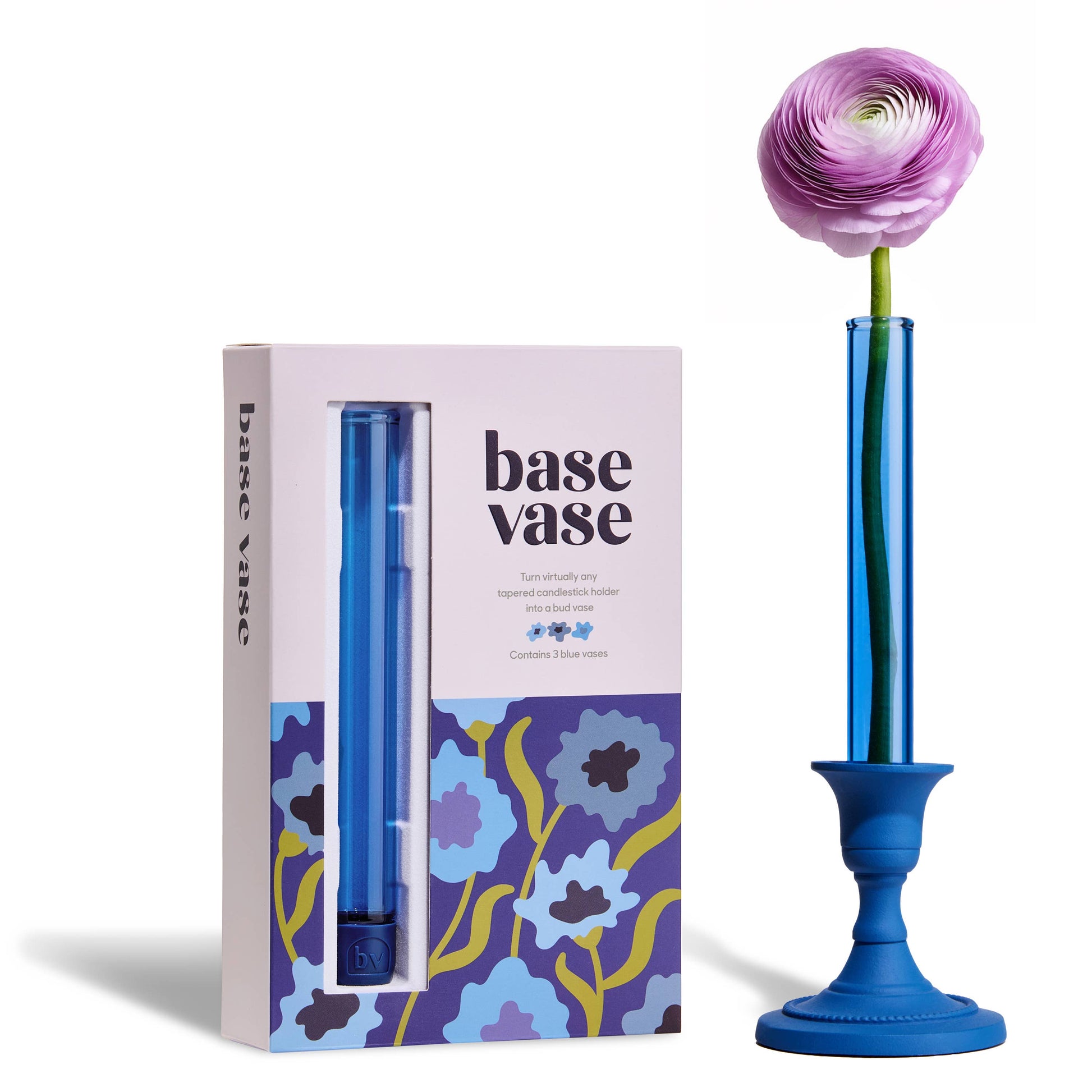 Blue base vase with a pink flower and its packaging on a white background