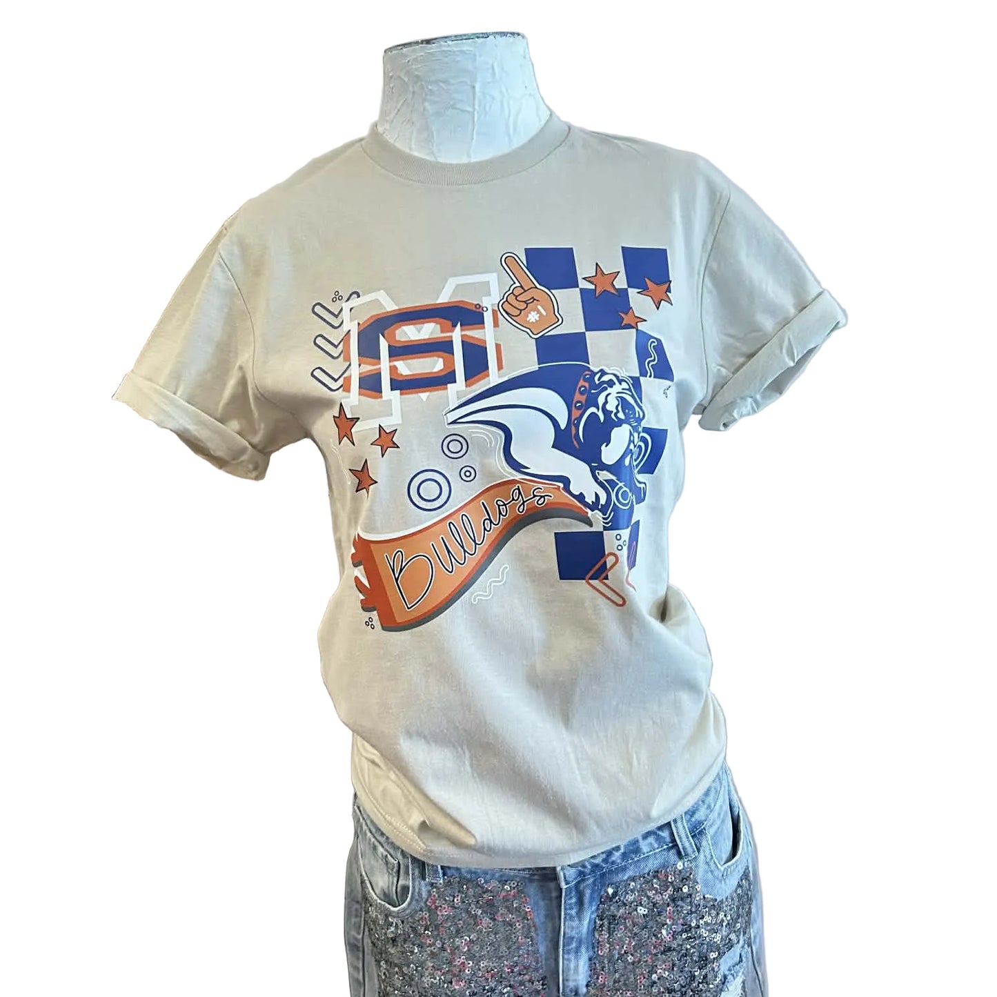 Tan colored tshirt with a graphic depicting the bulldog mascot, an orange pennant that says "bulldogs" and MS, on a mannequin with a white background