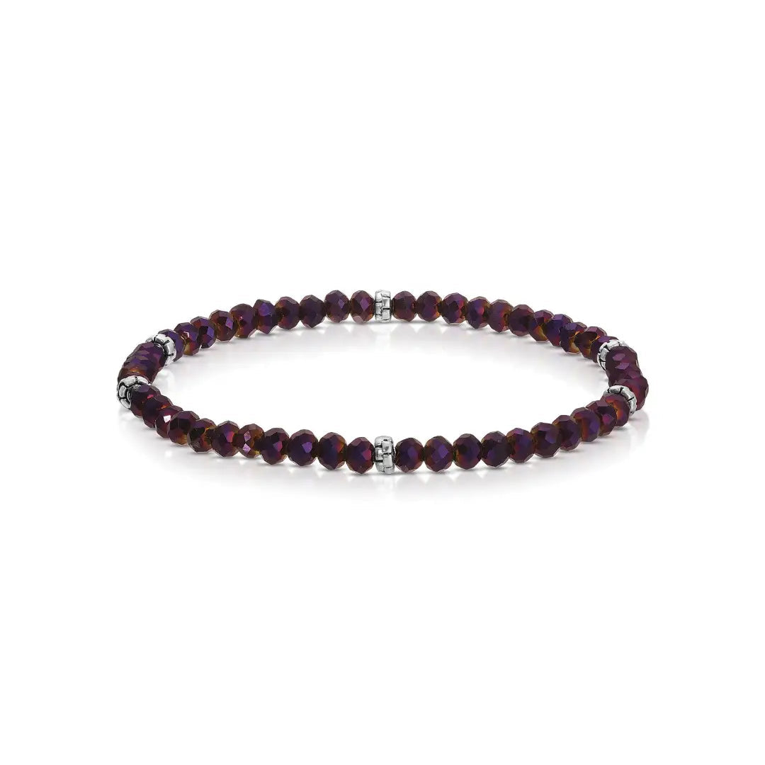 Purple beaded bracelet with silver accents on a white background