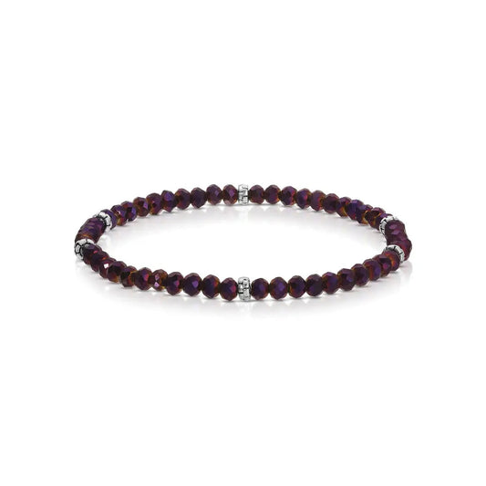 Purple beaded bracelet with silver accents on a white background