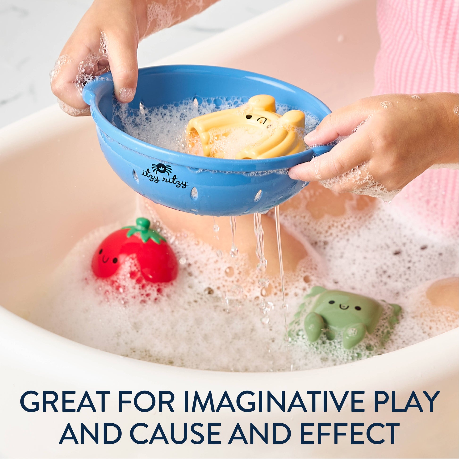 Child playing with bath toys in a bathtub, including a blue colander and colorful rubber toys with text that reads "Great for imaginative play and cause and effect"