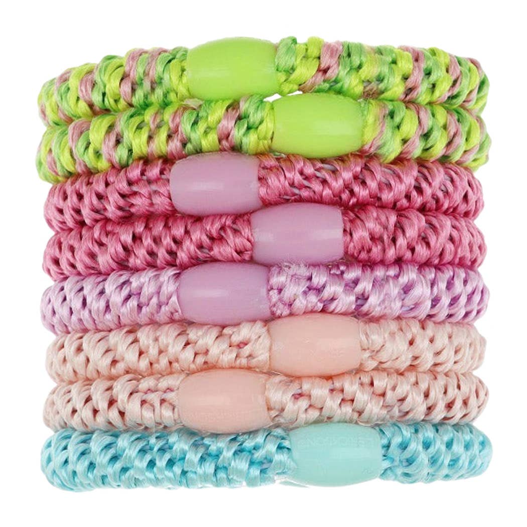 A stack of eight braided elastic wristbands with smooth bead accents in various pastel and bright colors, including lime green, pink, purple, peach, and light blue, on a white background.