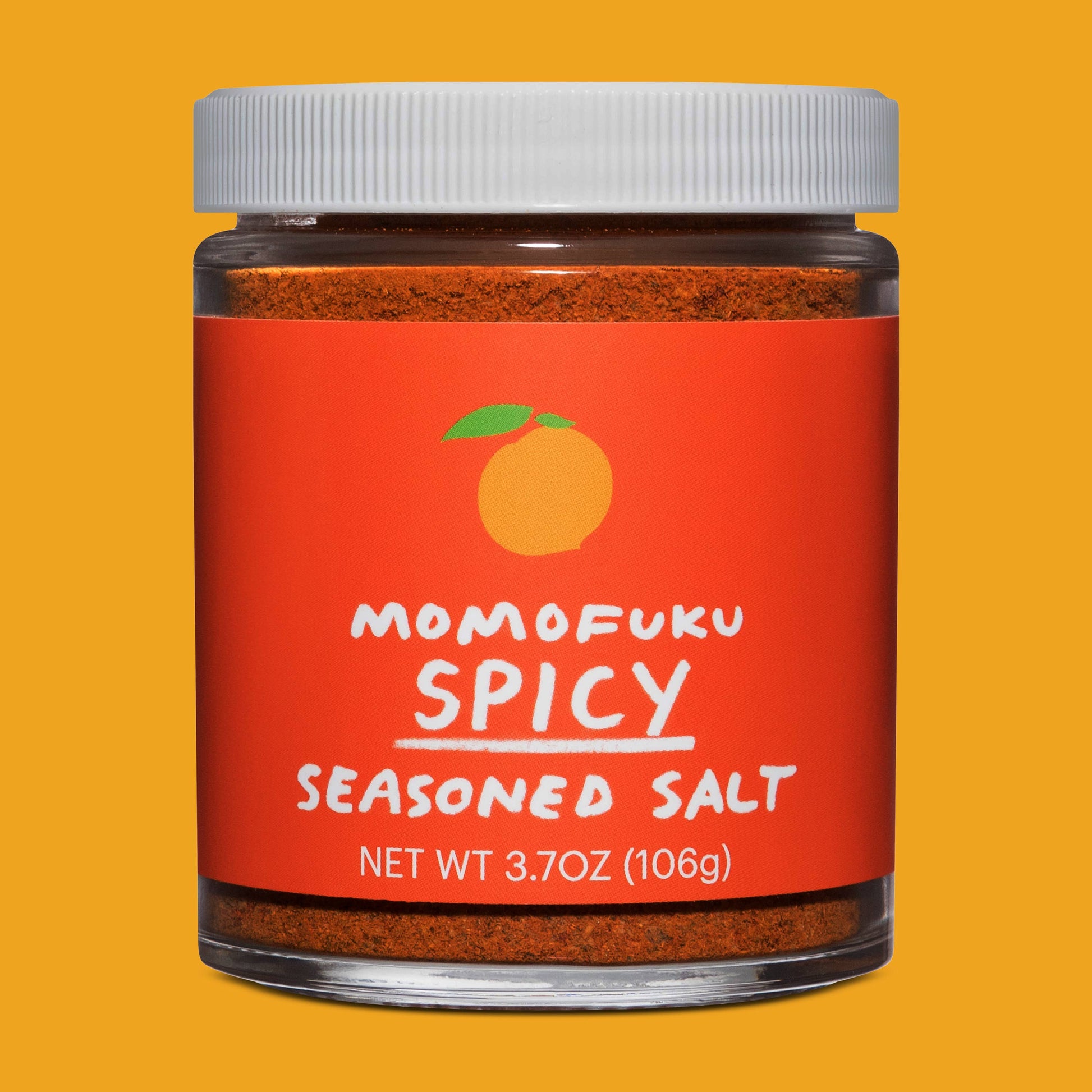 Jar of Momofuku Spicy Seasoned Salt on a yellow background