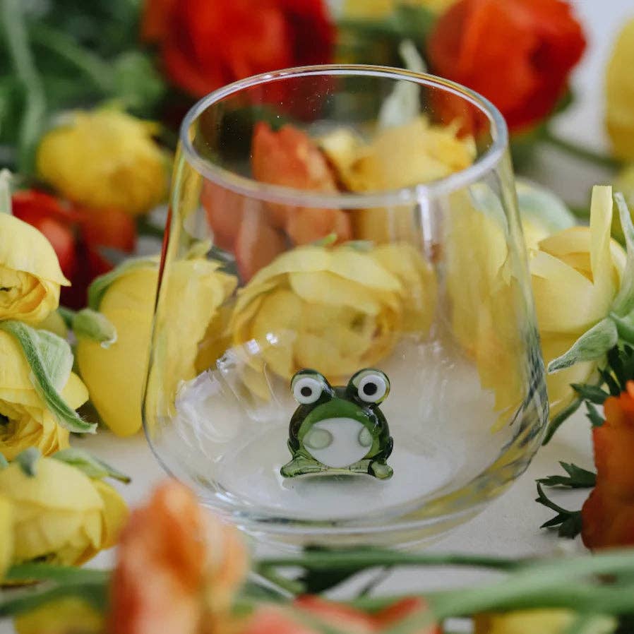 Clear glass with a frog design surrounded by yellow flowers