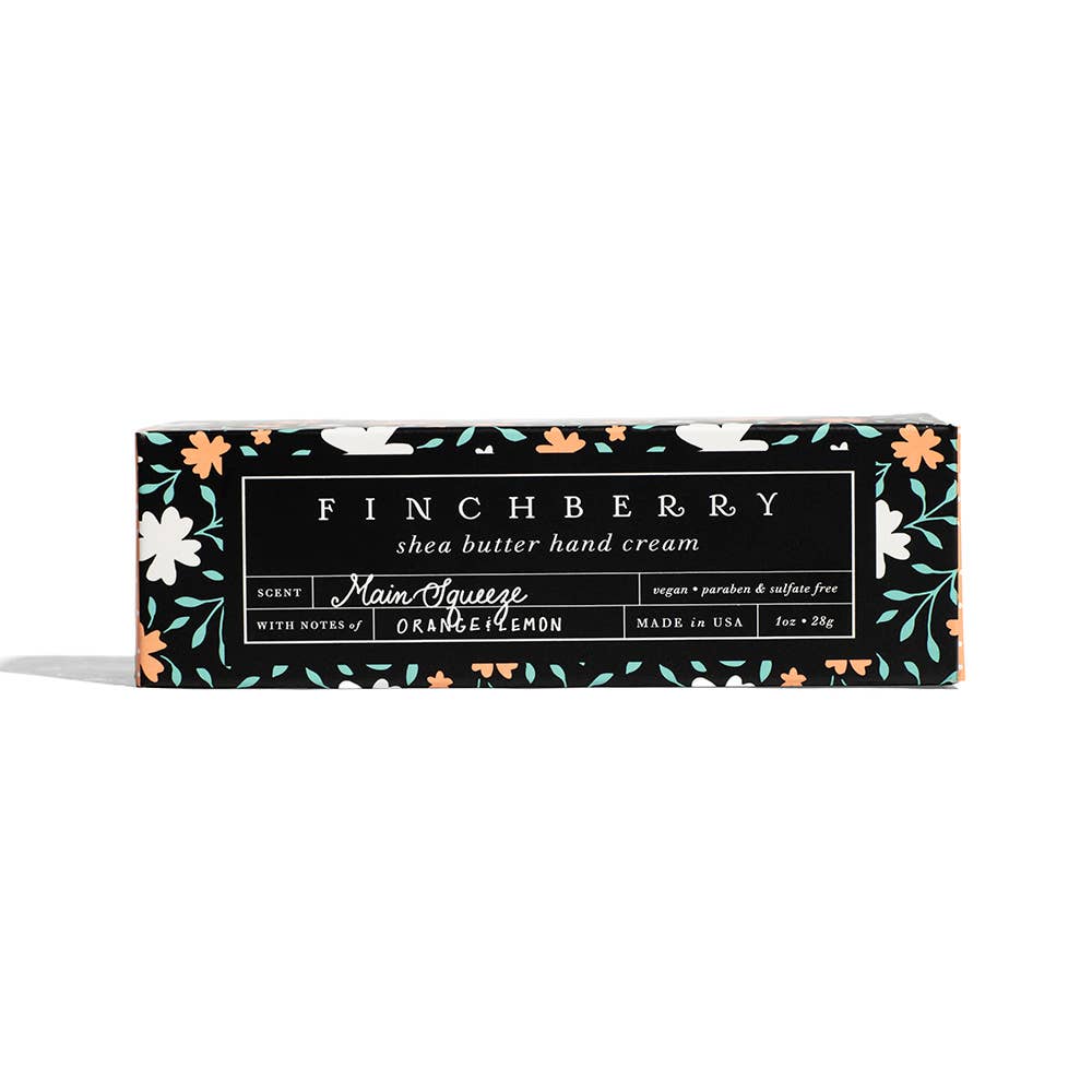 Finchberry shea butter hand cream packaging with floral design on a white background