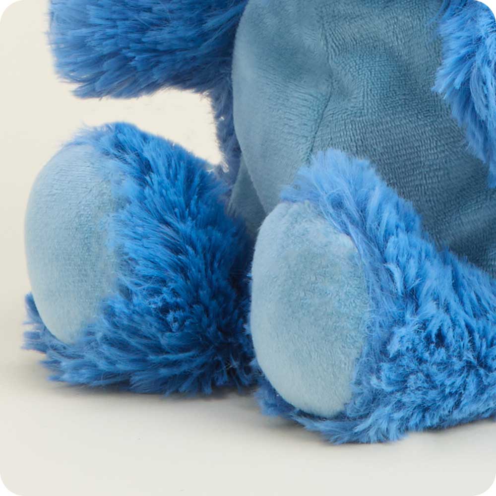 Close-up of blue plush toy feet on a white background